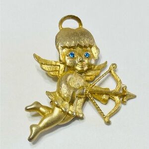 Vintage Mamselle Angel/cherub brooch with blue rhinestone eyes.  Mint condition.